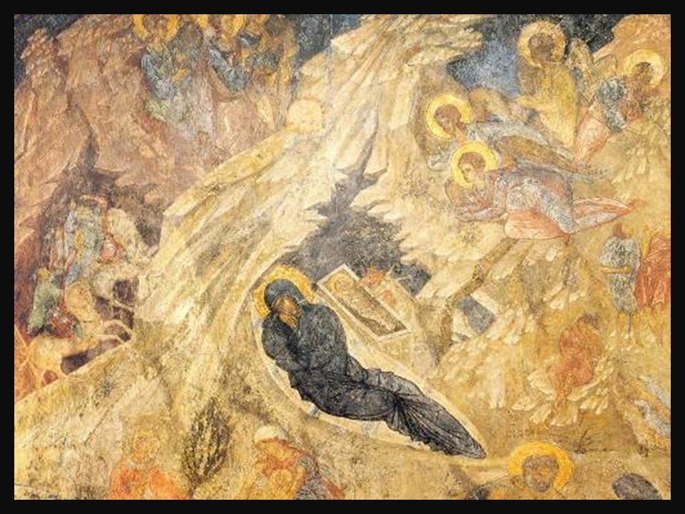 Byzantine fresco of the Nativity in the Perivleptos Monastery Katholikon at Mystra, showing the Virgin Mary reclining and the infant Jesus in a cave-like setting, surrounded by haloed figures and a rocky landscape rendered in rich, earth-toned pigments typical of 14th-century Orthodox iconography.