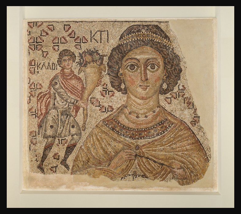 Byzantine floor mosaic fragment showing a richly bejeweled female figure holding a Roman measuring tool identified as Ktisis, the personification of generous foundation, with a partially visible male figure holding a cornucopia at left; made of marble and glass, ca. 500–550, Metropolitan Museum of Art, New York.