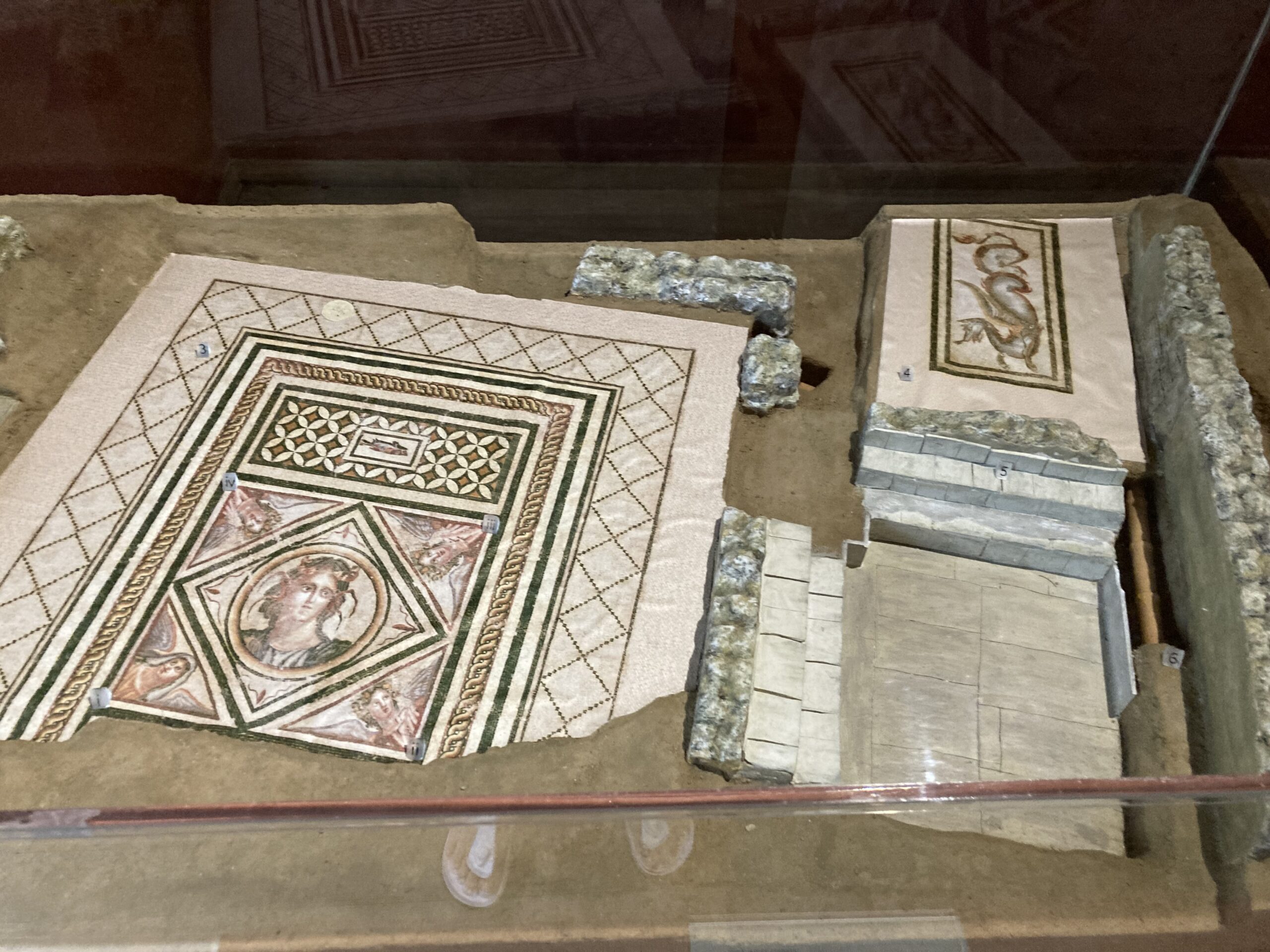 House of Euripos representation of the triclinium floor mosaic of the four Seasons with a sea divinity in the center and the 'Dragon' passageway floor mosaic.