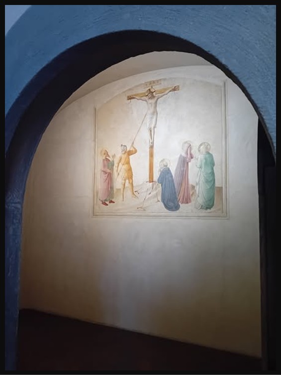 Fresco by Fra Beato Angelico (1395–1455) titled “Crucifixion with the Virgin Mary, Martha, and Saints Mark, Dominic, and Longino” (1440–1442). The figures are set against a serene, gold-hued background typical of Angelico’s early Renaissance style, located in Cell 42 of the Convent of San Marco, Florence, Italy.