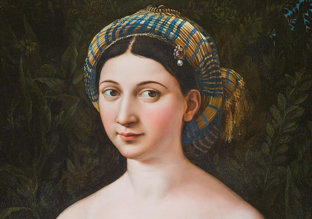 Raphael, La Fornarina, c.1519–20, oil on panel, detail of the face. A close-up of a young woman's face with dark, almond-shaped eyes, delicate features, and a serene, quietly alluring expression, rendered with extraordinary softness and naturalism.