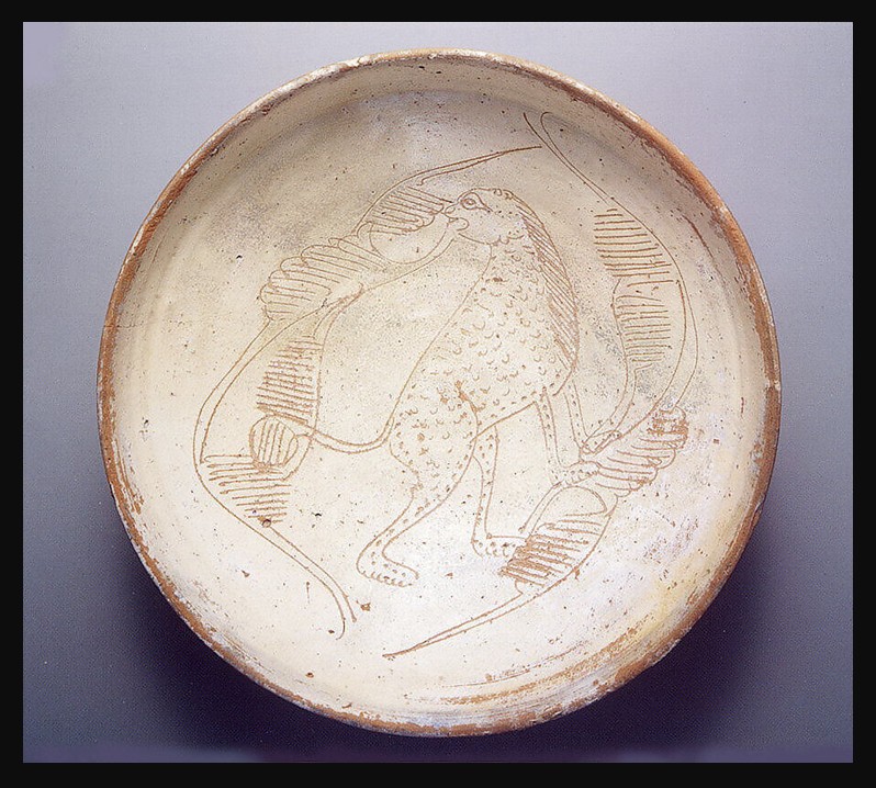 Bowl with Cheetah, Byzantine, 11th–13th century. A shallow ceramic bowl featuring an engraved depiction of a cheetah on its interior. Typical of Byzantine slipware, the red clay body is covered with slip that is then cut away and incised to create the animal image.