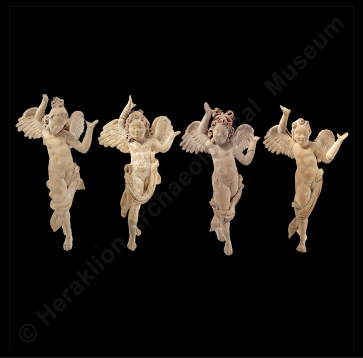 Four Hellenistic terracotta Cupid figurines with wings, shown in lively poses, from a 3rd–2nd century BC tomb at Gortyn, Crete.